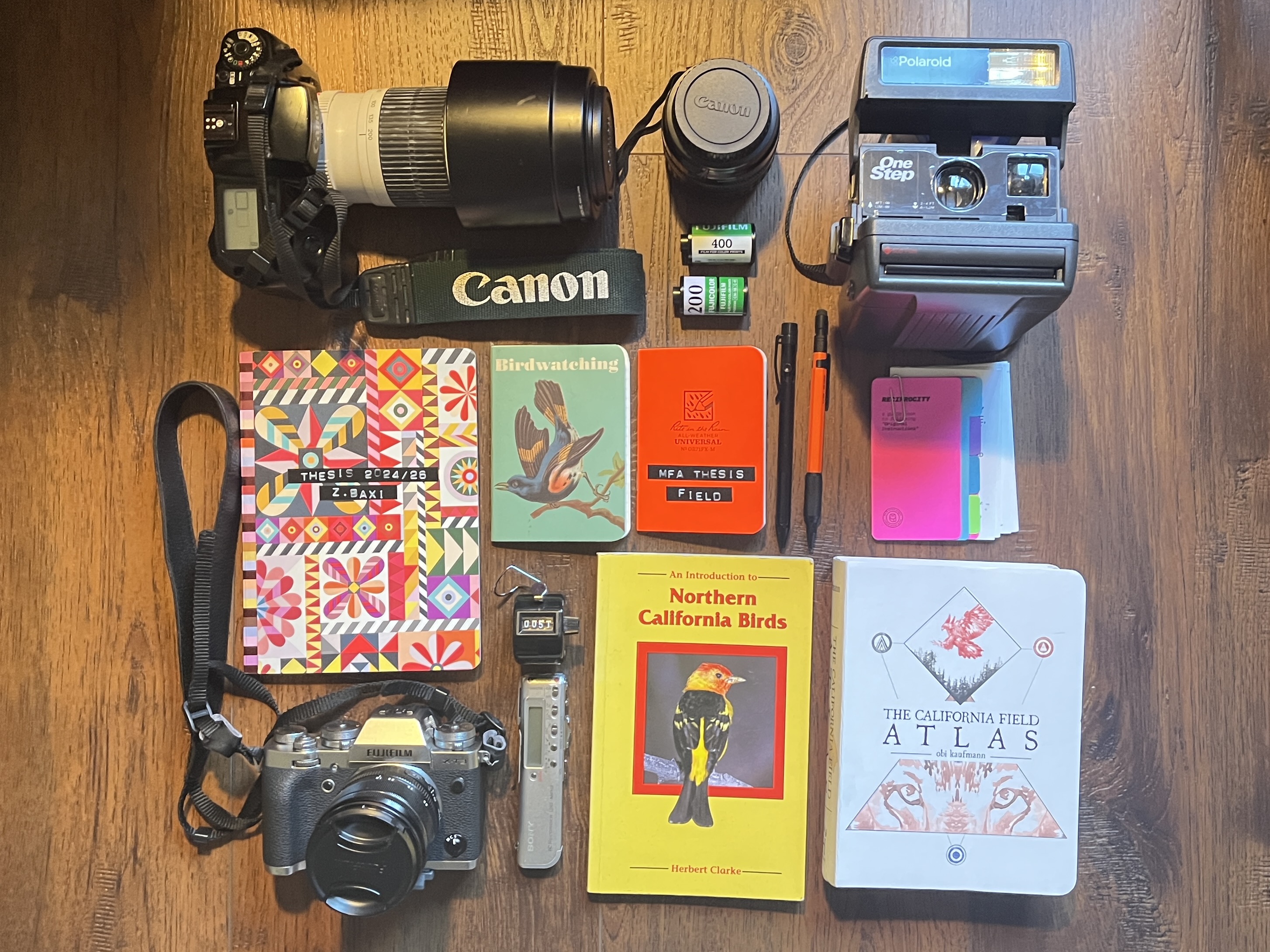 field research materials including cameras, notebooks, and field guides