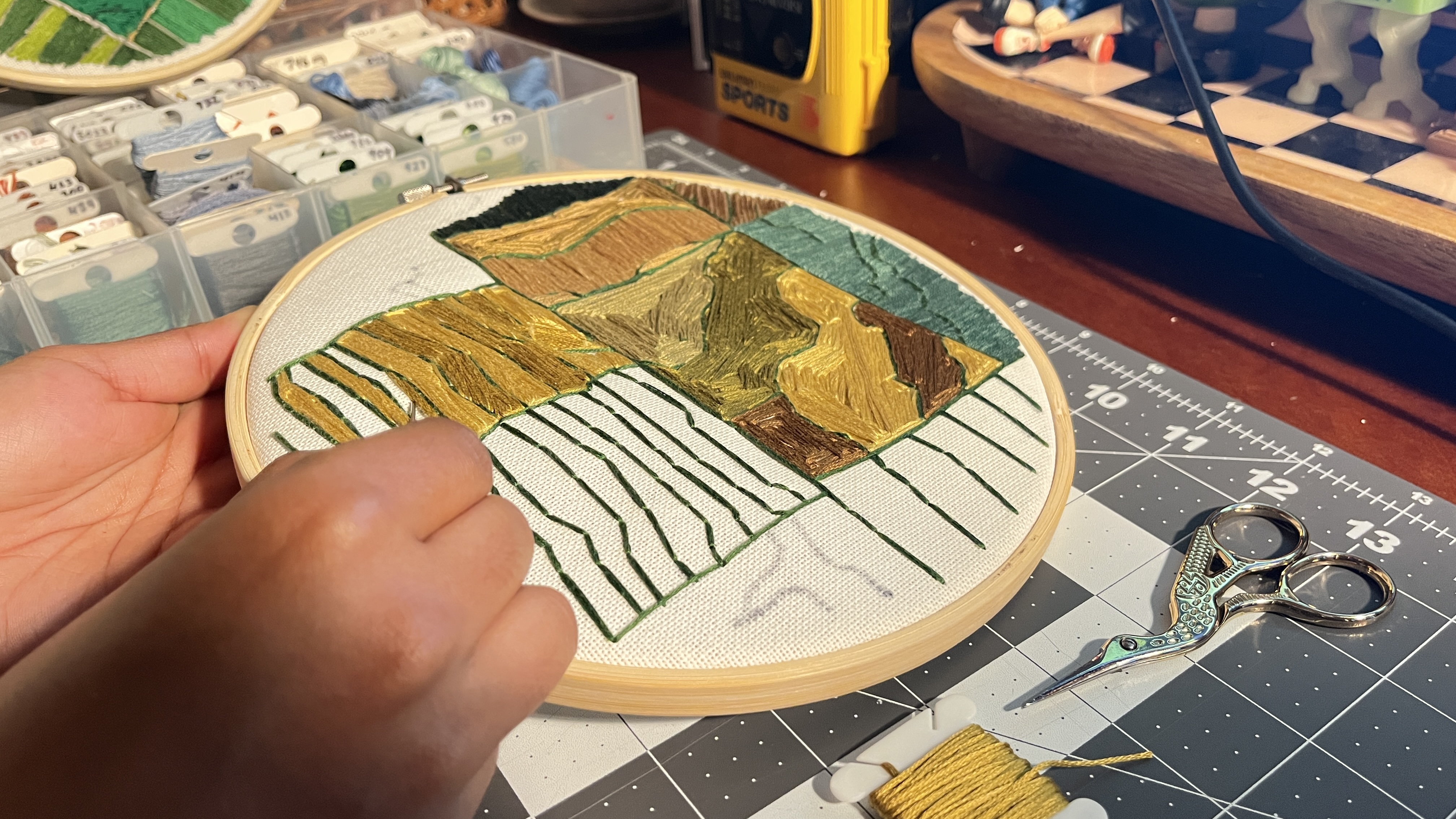 stitching the agriculture embroidery hoop in progress