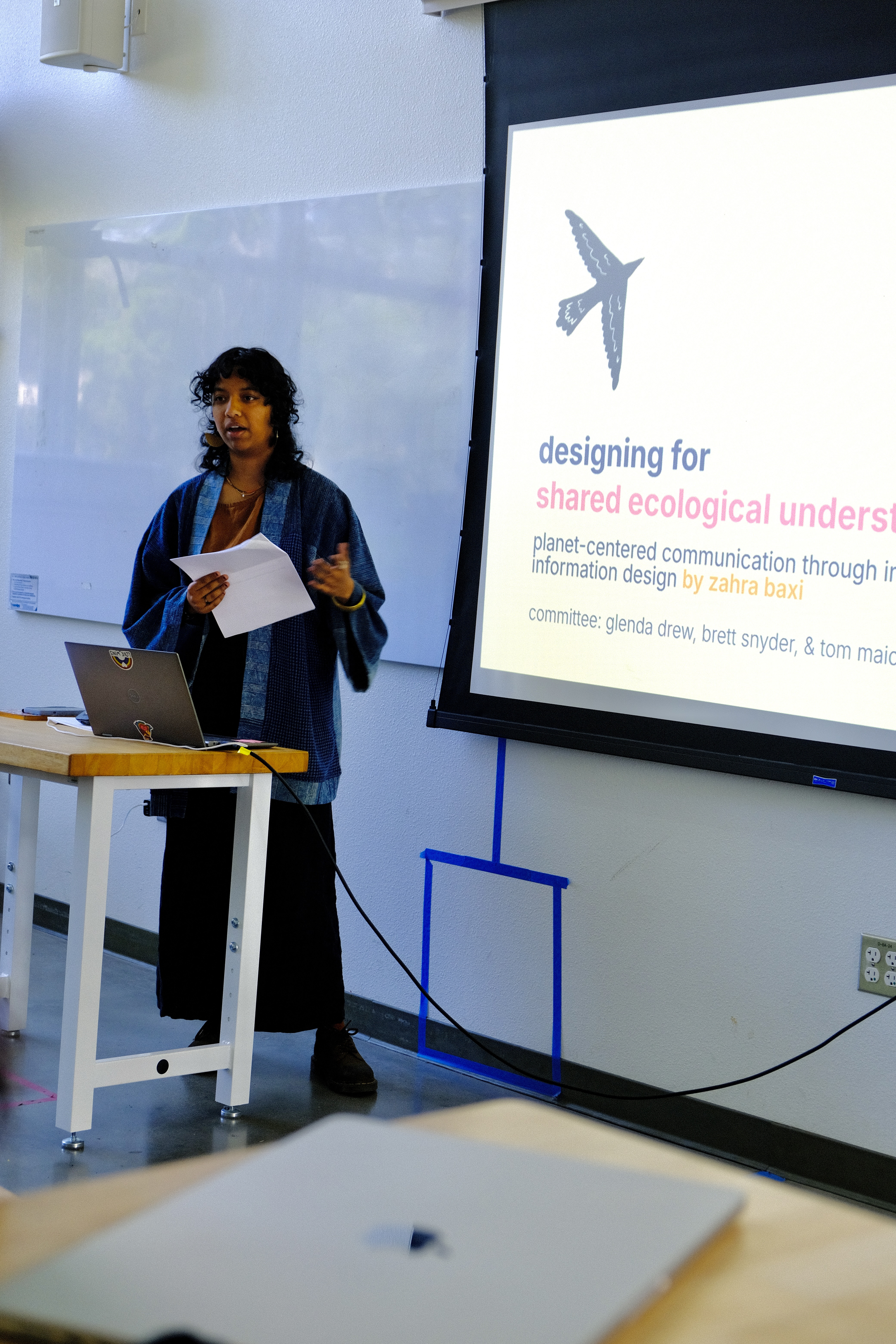 zahra presenting the thesis work to the at final mfa thesis review